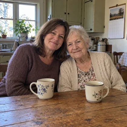 Karen and her mother at the kitchen table.