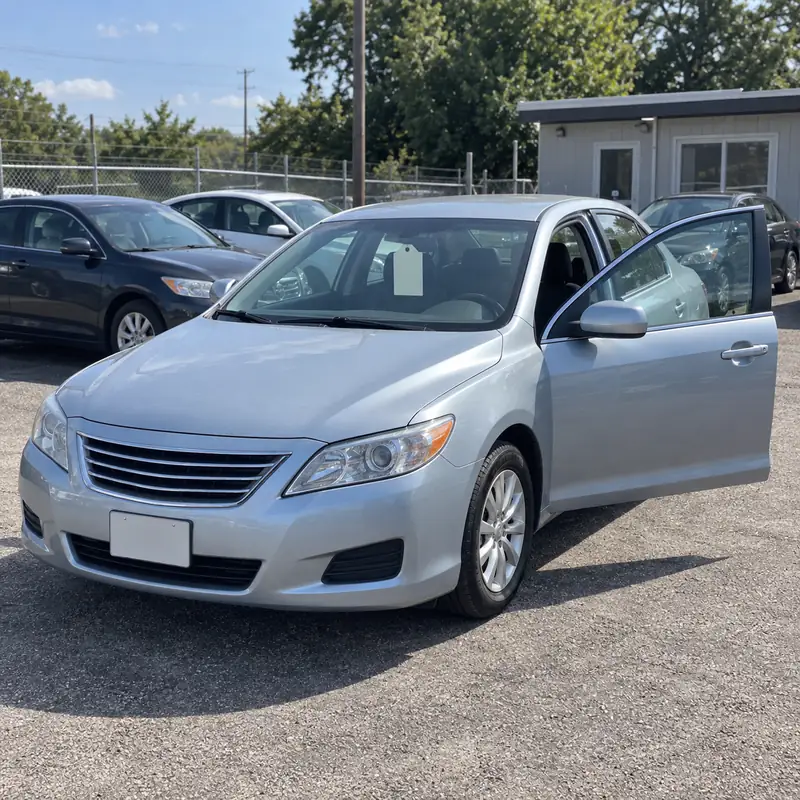 A used car for sale on a small lot