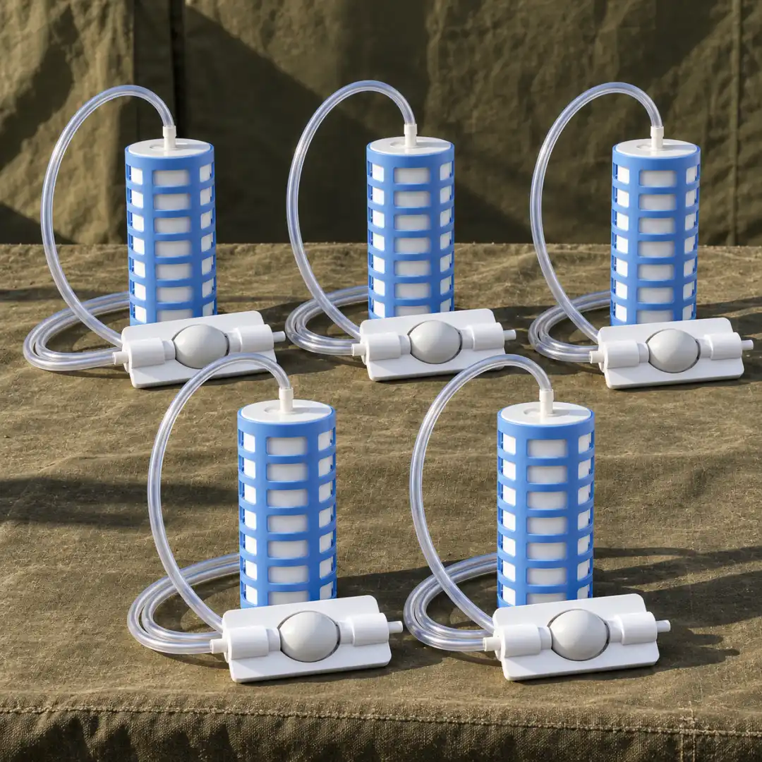 Five TerraPore filters lined up on olive canvas, each with its own hose and squeeze bulb.