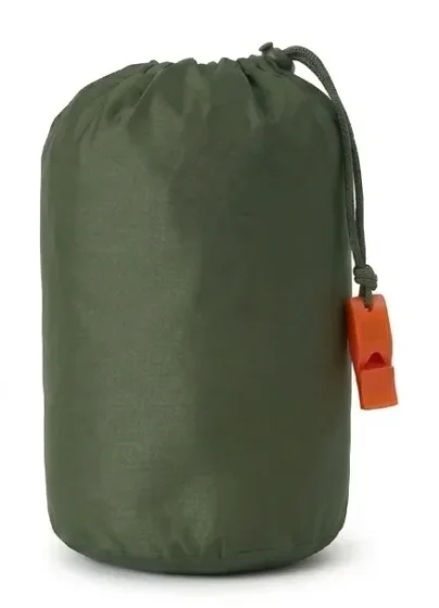 A packed TerraShell, an olive-green sack with an orange whistle on its drawcord.