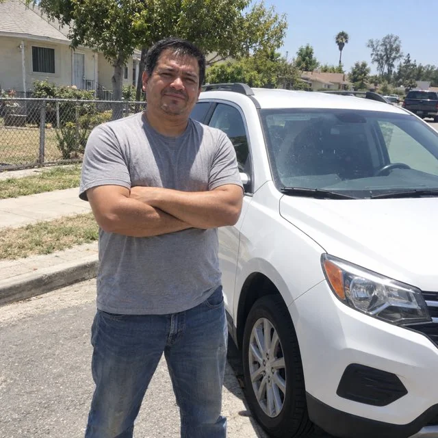 Tom R. beside the car he bought